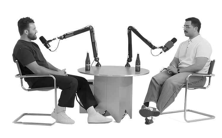 Two people recording a conversation in the Stabledash studio